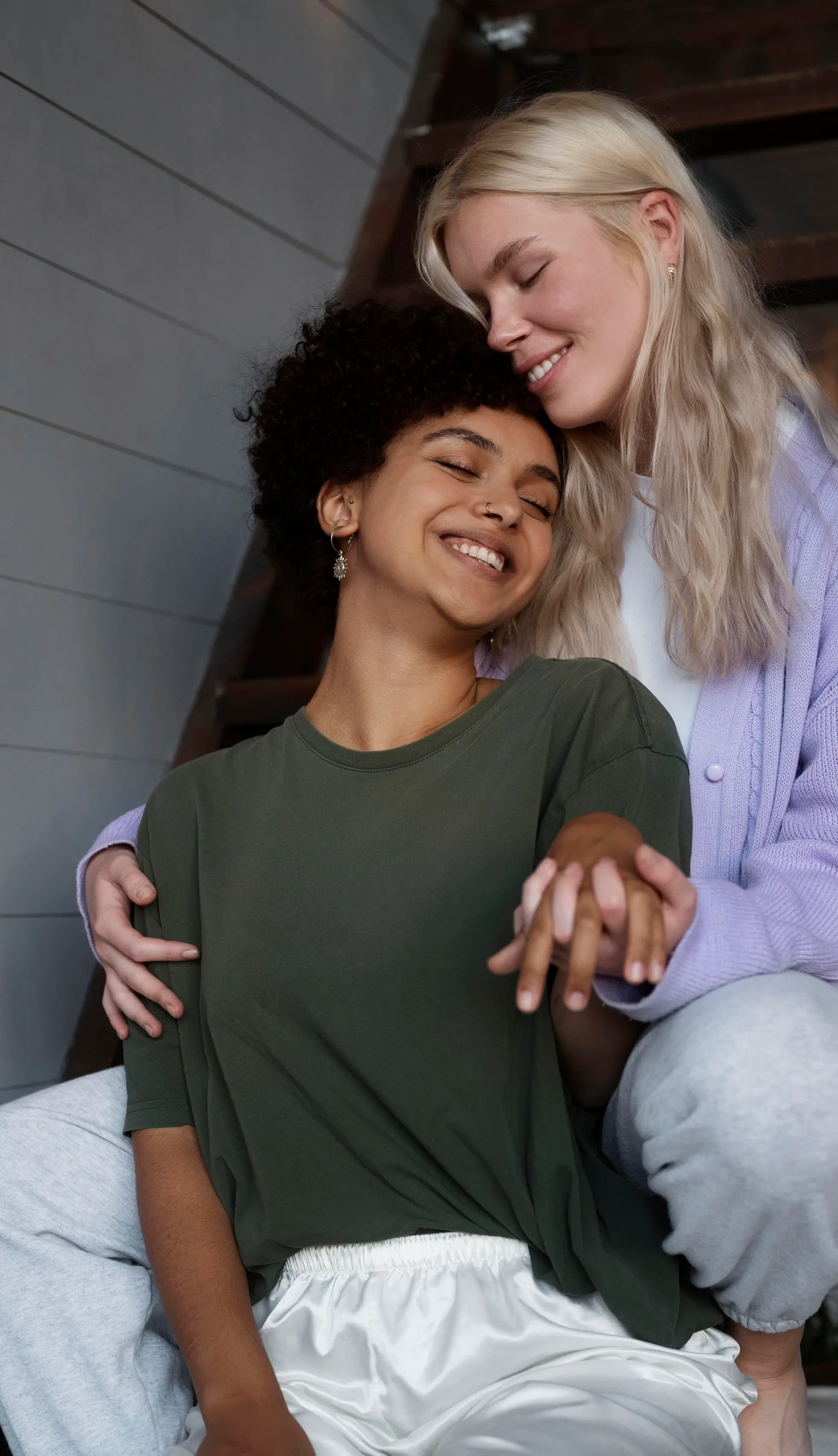Two people sharing a warm, platonic embrace